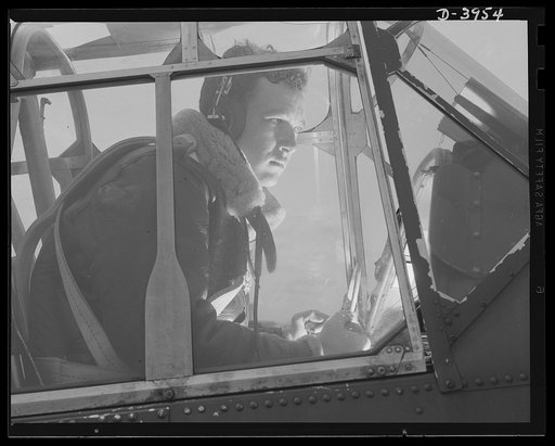 Fort Benning. Air corps pilots in training. An eaglet tries his wings. When this student pilot has completed his training course at Fort Benning, Georgia, the Army will have another good man who knows what it is all about