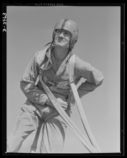 Fort Benning. Parachute troops. He's a landsman again. One of Uncle Sam's student paratroopers at Fort Benning, Georgia unbuckles his chute gear after a trip that would have done credit to one of the oldtimers