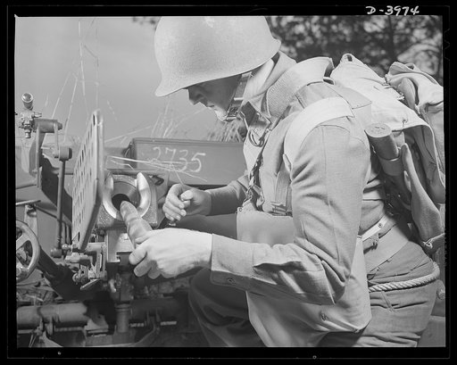 Fort Benning. Anti-tank gun crews. The infantryman, loading a 37mm anti-tank gun, trains at Fort Benning, Georgia to do many useful military chores with the this hard-hitting piece