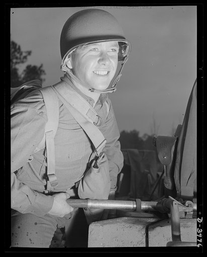 Fort Benning. Anti-tank gun crews. Whoa! That did it. An anti-tank gunner, finishing training at Fort Benning, Georgia has just made a bulls-eye