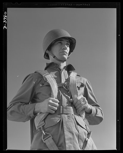 Fort Benning. Parachute troops. Uncle Sam picks a high type of man for a parachute infantryman. This student paratrooper at Fort Benning, Goergia has just completed a descent of which any oldtimer would be proud