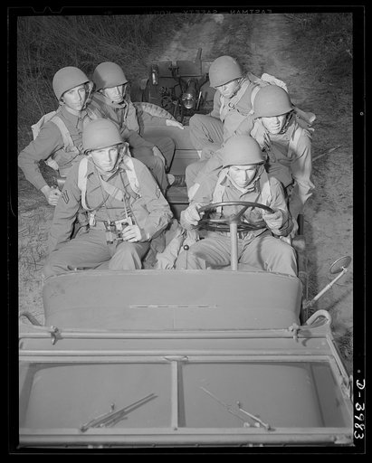 Fort Benning. Jeeps. American roughriders, 1942 style. The crew of this army jeep, hardboiled as the tough little car itself, know some tricks that will drive the Axis crazy