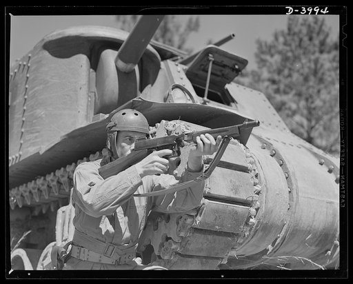Fort Benning. Tommy gunners, armored forces. The tank soldier finds many chores for the Thompson sub-machine gun, familiarly known as the Tommy gun