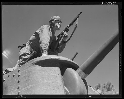Fort Benning. Tommy gunners, armored forces. The tank soldier finds many chores for the Thompson sub-machine gun, familiarly known as the Tommy gun