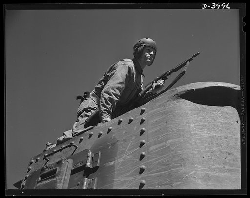 Fort Benning. Tommy gunners, armored forces. The tank soldier finds many chores for the Thompson sub-machine gun, familiarly known as the Tommy gun