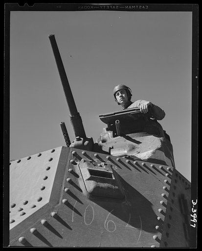 Tank forces. Fort Benning. A lot of headaches for the Axis are packed in this combination of good American soldiers and good American equipment. A medium (M-3) tank and a trainee of the armored forces completing the course at Fort Benning, Georgia