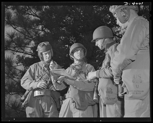 Fort Benning. Armored forces personnel. Council of the powers. A group of armored-forces officers work out a tactical problem and map a course of action that will broaden the training program at Fort Benning, Georgia