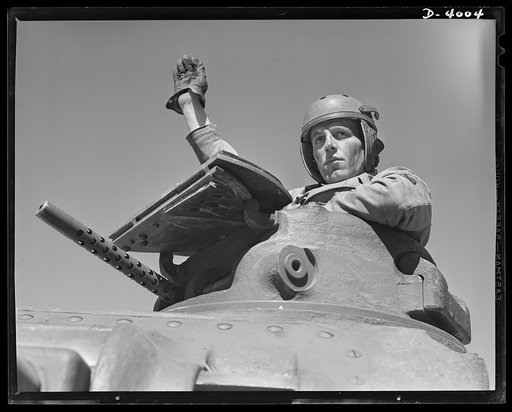 Fort Benning. Tank forces. A lot of headaches for the Axis are packed in this combination of good American soldier and good American equipment. A medium (M-3) tank and a trainee of the armored forces completing the course at Fort Benning, Georgia