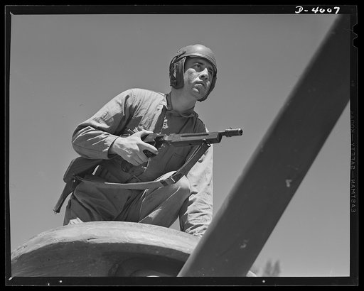 Fort Benning. Tommy gunners, armored forces. The tank soldier finds many chores for the Thompson sub-machine gun, familiarly known as the Tommy gun
