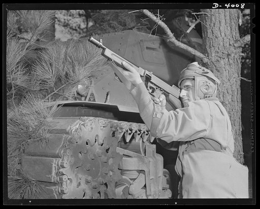 Fort Benning. Tommy gunners, armored forces. The tank soldier finds many chores for the Thompson sub-machine gun, familiarly known as the Tommy gun