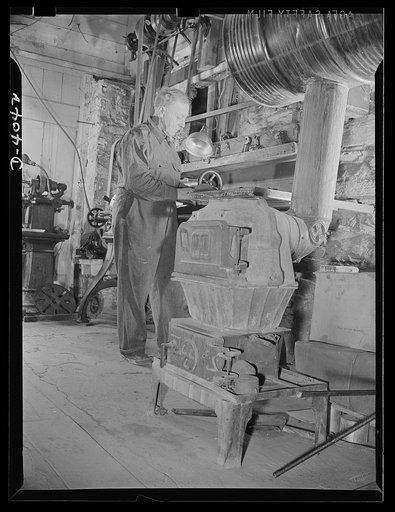 Dr. Bair. Philosopher and scientist backs war production drive with his labor. Dr. Bair, former college professor and holder of eleven degrees, heads the war production drive as a sub-contractor. He saws steel bullets to required sizes on power saws