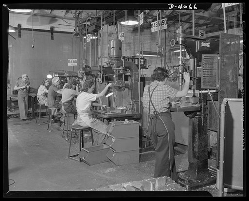 Women aircraft workers. Women man America's machines in a West Coast airplane factory, where the swing shift of drill press operators is composed almost entirely of women