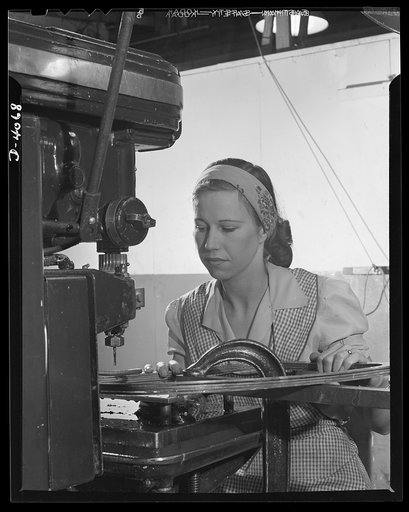 Women aircraft workers. Women are doing men's jobs and beating their production records in a West Coast airplane factory. Feminine operators of tapping machines in this plant have made 400 more tapping operations in the seven and one half hour swingw shift than men employed on the eight hour day shi
