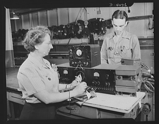 Women aircraft workers. Precision assembly at one of the West Coast's huge aircraft plants. A woman inspector here checks electrical assemblies. Vega