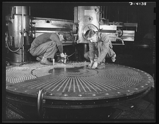 Production. Marine boilers. Bronze heads for surface condensors are drilled and inspected by experienced men at a big Midwest plant now producing essential equipment for the Army