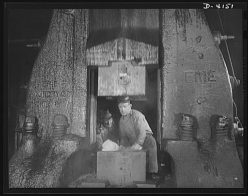 Production. Marine boilers. A steel valve is shaped on a large Erie forging hammer at a big Midwest plant processing much essential equipment for the Army