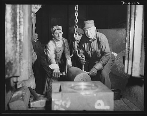 Production. Marine boilers. Driving a die key on a forging hammer in a big Midwest plant processing heavy hydraulic fittings and other necessary equipment for the Army