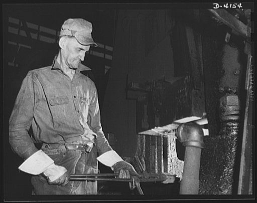 Production. Marine boilers. Forging an ell on a power hammer in a large plant producing heavy hydraulic fittings and other essential equipment for the Army