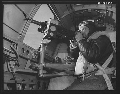Mitchell Field. The side gun of an American bomber gets plenty of work during an air battle. Manned by a brave, able, well-equipped gunner, it's one of the tools that is steadily thinning out Japanazi air power