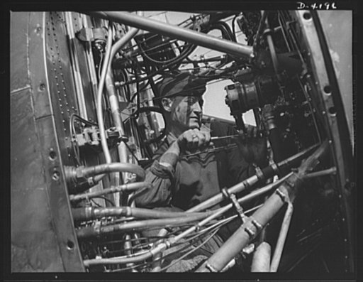 Mitchell Field. "Plumbing system" of a fighting plane. The rear end of an air-cooled aviation engine with cowling removed, showing fuel lines, ignition leads, instrument leads and other intimate portions of the anatomy of a mighty flying power plant