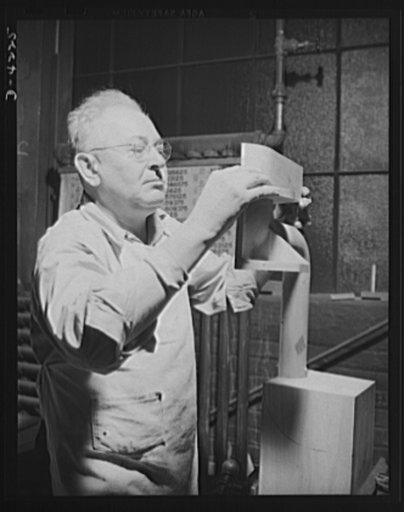Production. Diesel engines. Good patterns help the war production drive by speeding foundry and machine operations. A skilled pattern maker of a Midwest engine plant checks against blueprint measurements laid down by the design engineers