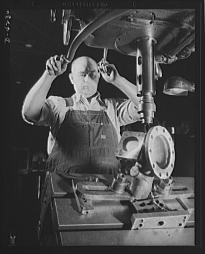 Production. Diesel engines. Diesel power for the Navy. Drilling a pump connection at an Ohio engine manufacturing plant