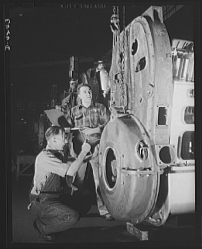 Production. Diesel engines. The gear train housing of a diesel engine for the Navy is assembled at a Midwest manufacturing plant