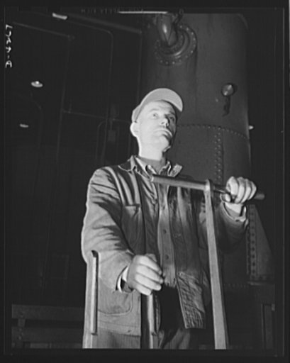 Tank armor production. Carnegie-Illinois Steel Corporation. Farrell, Pennsylvania. Armor plate press operator. The man who handles the 2000 ton plate-finishing press at an Eastern mill has a very responsible position. Great skill and care are required as he operates the huge machine with only three 