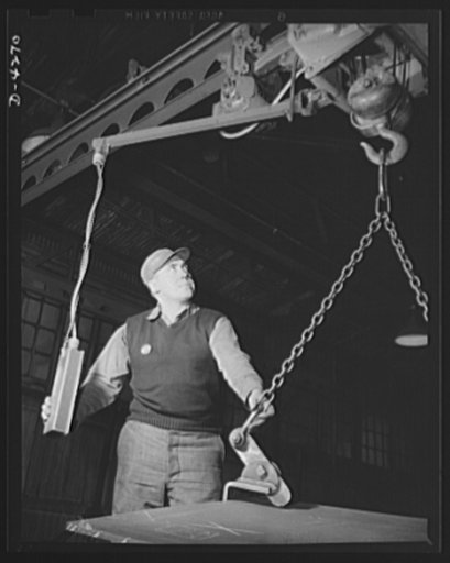Tank armor production. Carnegie-Illinois Steel Corporation. Farrell, Pennsylvania. Moving tank armor for our fighting forces. A small overhead crane in an Eastern mill moves a section of protective plate