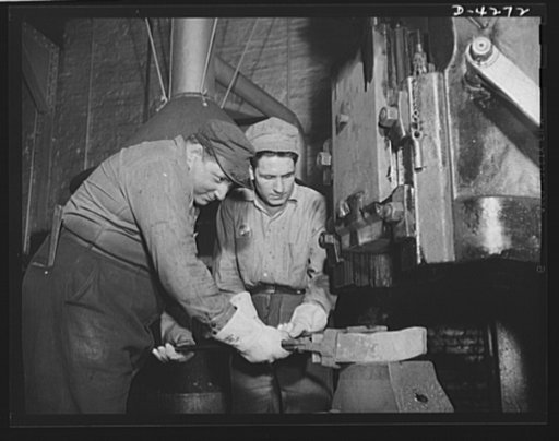 Tank armor production. Carnegie-Illinois Steel Corporation. Farrell, Pennsylvania. Cutting tools for planers in an armor plate mill are forged from high speed steel on the steam hammer of a big Eastern mill producing tank armor