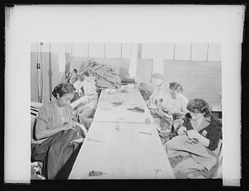 Women workers at quartermaster corps. Women workers of all racial groups are being drawn into war production. These employees of an Eastern quartermaster corps depot are sewing sleeves into army overcoats. Philadelphia Quartermaster Corps