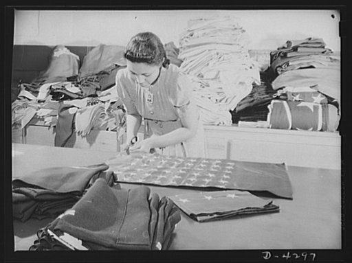 Women workers at quartermaster corps. The tradition of Betsy Ross is being kept alive in this quartermaster depot where this young woman worker assists in the creation of American flags for military activities. Philadelphia Quartermaster Corps