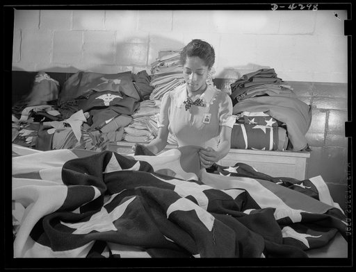 Women workers at quartermaster depot. The tradition of Betsy Ross is being kept alive in this quartermaster corps depot where this young woman worker assists in the creation of American flags for military activitities. Philadelphia Quartermaster Corps