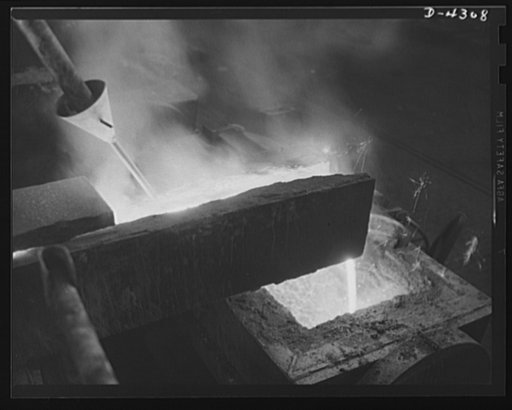 Production. Milling machines and machine castings. The cupolas spout. As the molten iron pours from the cupola, a special ingredient is added through the pipe and funnel shown here -- one which helps to give the cast iron special qualities which have been predetermined by careful research and consta