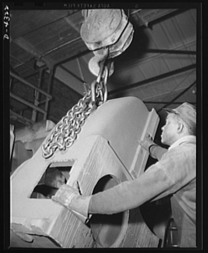 Production. Milling machines and machine castings. This milling machine head's tool casting is ready for machining. Location: a large Midwest tool plant