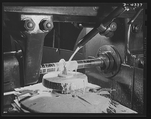 Production. Milling machines and machine castings. So covered with coolant that neither the cutter nor the work can be seen, this small milling machine is having clutch teeth cut in its face. As in this case, the fixtures required to hold or turn small pieces of work properly are frequently many tim