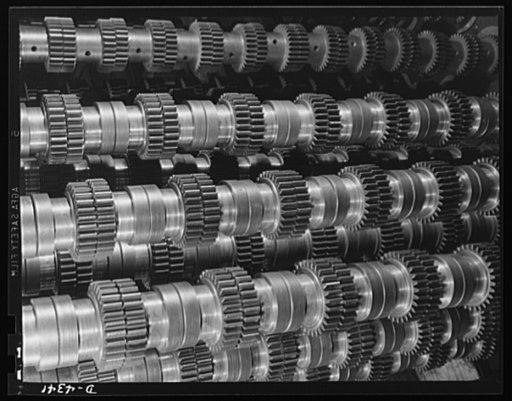Production. Milling machines and machine castings. These are spur gears piled up at a large Midwest machine tool plant producing highly essential equipment for making various war materials