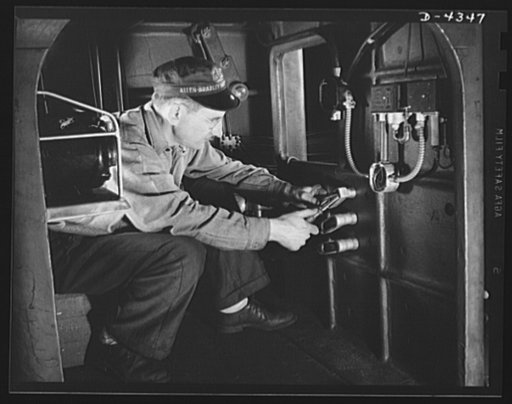 Production. Milling machines and machine castings. The electrician is indispensable in the manufacture of modern machine tools. This one is crouched in the base of a powerful giant milling machine which may be used to help make aircraft engine or propeller parts day in and day out. Machines of this 
