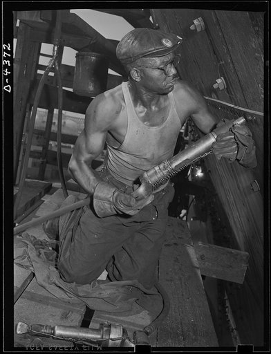 Manpower. Negro shipyard workers. Skills which contributed to America's success in World War I are vital to our efforts in World War II. This Negro riveter is a veteran employee in a large Eastern shipyard. Another Negro broke the world record for riveting in World War I. Federal Shipbuilding and Dr