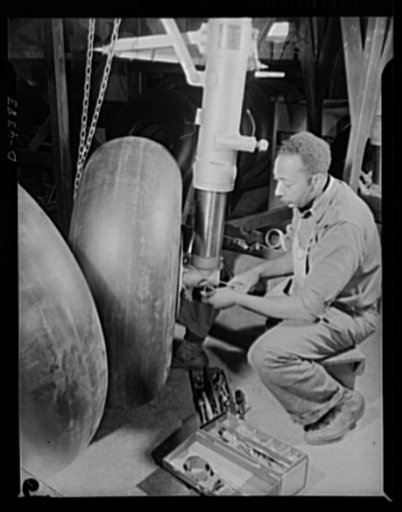 Manpower. Negro bomber plant workers. America draws its manpower from various racial groups. This Negro worker, assembling landing gear for a medium bomber, learned his craft under the government war training program. Glenn L. Martin Bomber Plant. Baltimore, Maryland