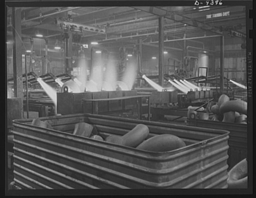 Production. Pipe fittings. Large pipe elbows for the Army are formed in a Midwest plant by heating lengths of pipe with gas flames and forcing them around a die. Tube Turn Incorporated