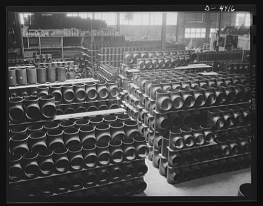 Production. Pipe fittings. Huge stocks of pipe fittings for Army equipment are being built up steadily in a big Midwest plant. The fittings are made by bending straight pipe, cutting off desired lengths from the curved sections and beveling edges for butt welding. Tube Turn Incorporated