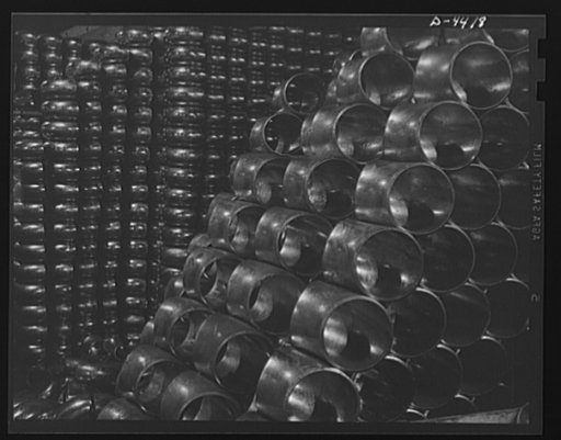 Production. Pipe fittings. Huge stocks of pipe fittings for Army equipment are being built up steadily in a big Midwest plant. The fittings are made by bending straight pipe, cutting off desired lengths from the curved sections and beveling edges for butt welding. Tube Turn Incorporated