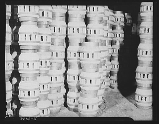 Production. Wagon wheels. Finished wagon wheel hub assemblies piled in the plant of a Southern wagon builder who is receiving a great demand for his products on account of the rubber shortage