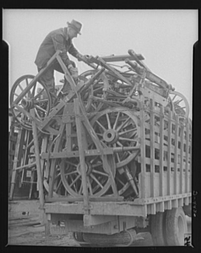 Production. Wagon wheels. Wheels for wagons. Loading completed wagon wheels and running gear assemblies from a Southern wagon wheel plant which is enjoying boom business these days because of the rubber shortage