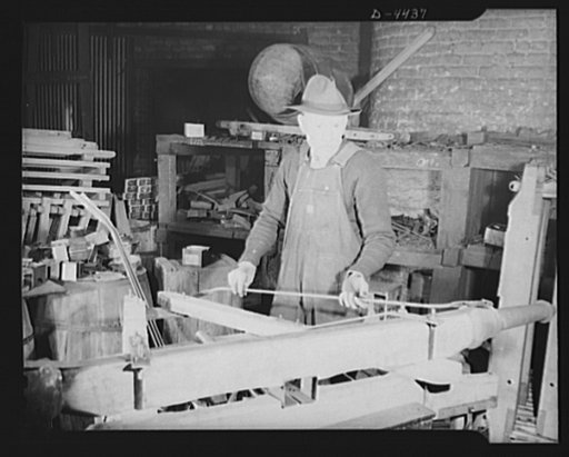Production. Wagon wheels. Revival of a dying art. Assembling wagon running gear in a Southern wagon plant which is receiving a rush of orders these days as a result of the rubber shortage