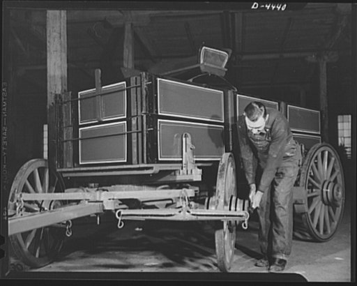 Production. Wagon wheels. From the wagon assembly of a Southern wagon plant comes this once familiar vehicle which is being built in great volume these days as a result of the rubber shortage. This worker is giving a farm wagon the final once-over