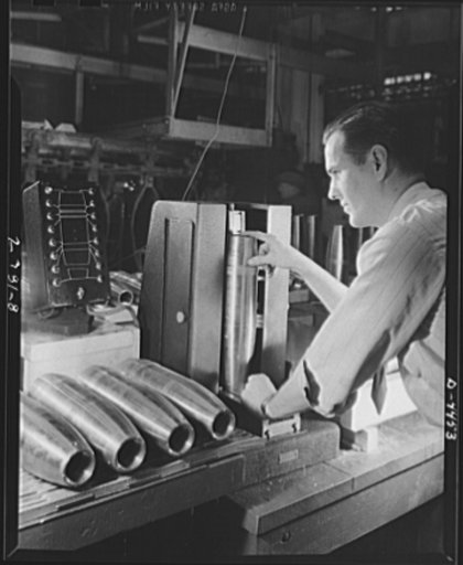 Conversion. Auto parts to artillery shells. Finished artillery shells are carefully gauged to ensure perfectly uniform ammunition for our fighting men. A converted Midwest auto plant is now producing these shells as efficiently as it turned out parts for automobiles