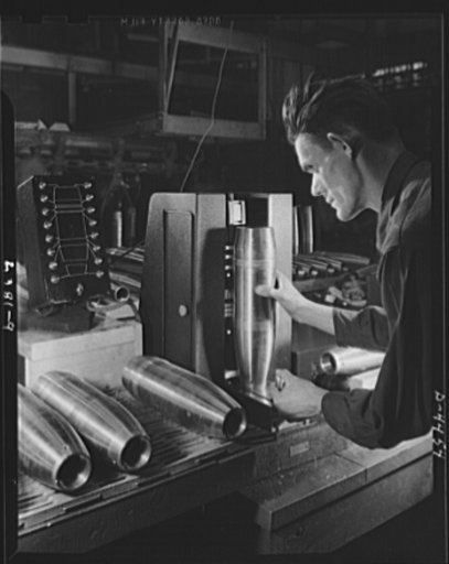 Conversion. Auto parts to artillery shells. Finished artillery shells are carefully gauged to ensure perfectly uniform ammunition for our fighting men. A converted Midwest auto plant is now producing these shells as efficiently as it turned out parts for automobiles