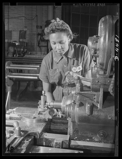 Manpower. Negro navy yard workers. Anna C. Marchand is one of the hundreds of young Negro women who have been given jobs in war production plants in recent months. She is shown undersizing bushing in the aircraft factory of a large Eastern navy yard